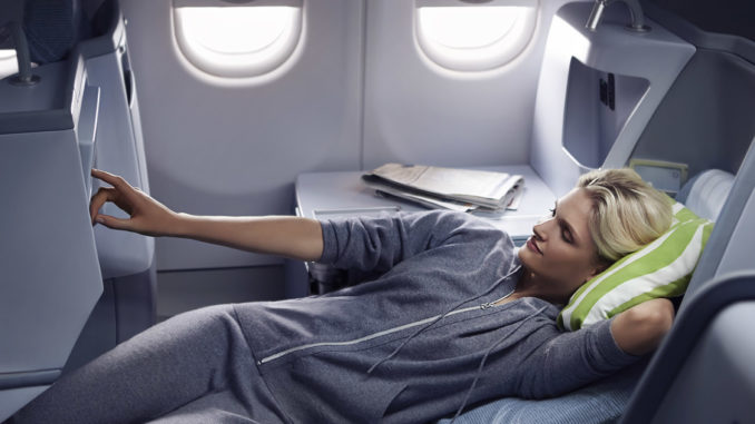 Finnair Business Class Airbus A330 woman resting watching a movie