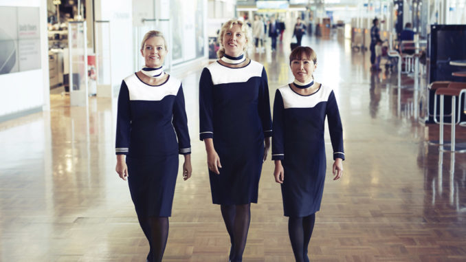 Finnair ground staff with uniform at Helsinki Vantaa