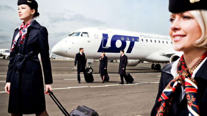 LOT pilots and cabin crew in front of aircraft