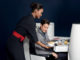 Air France new business class seat - male passenger during meal service being served by a flight attendant