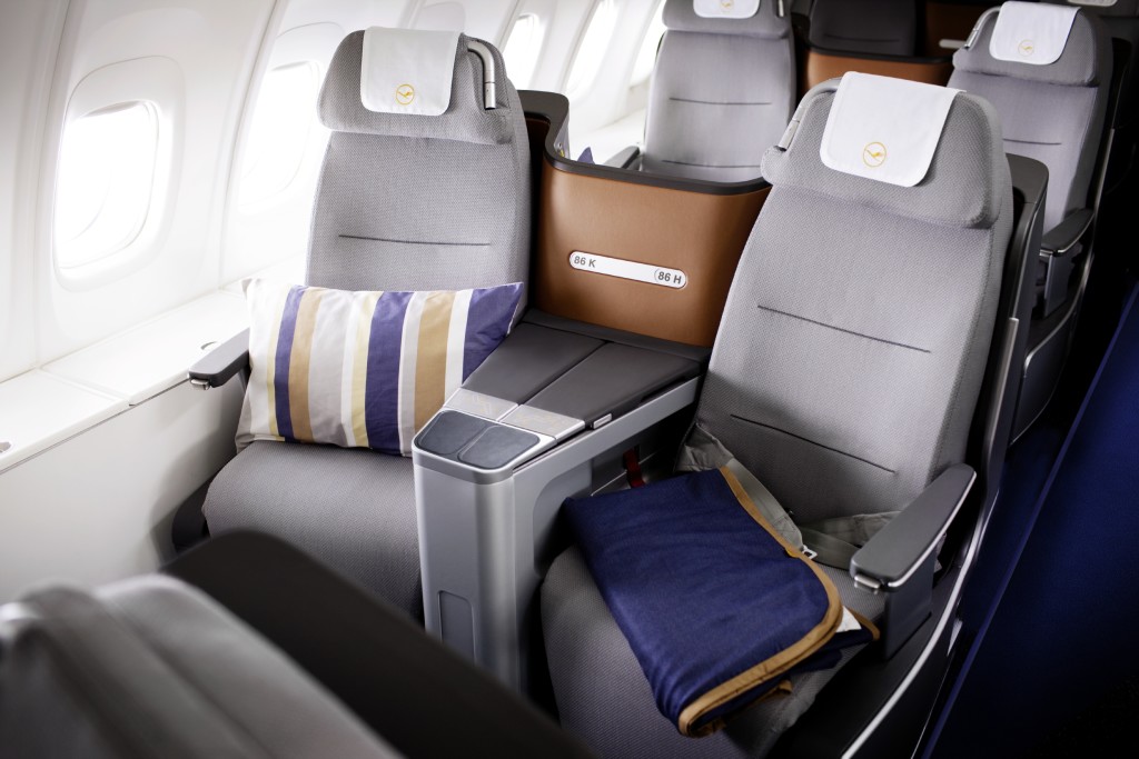 Lufthansa new business class Boeing 747-8 with a pillow and a blanket