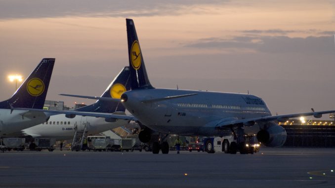 The apron at Frankfurt airport at sunset with Lufthansa aircrafts