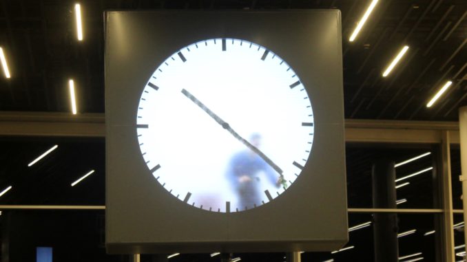 The clock with a man inside at Amsterdam Schiphol airport