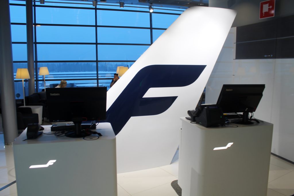 The new Finnair Lounge reception in Helsinki with Finnair tail