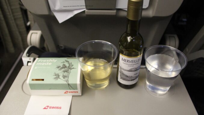 Hot snack and wine in Swiss economy class Stockholm-Zürich